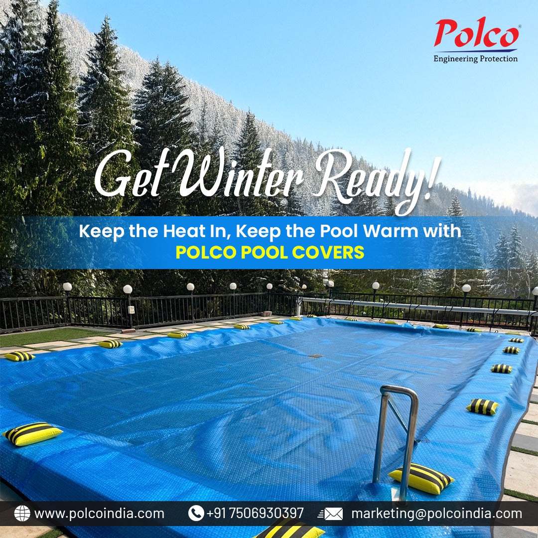 Outdoor swimming pool covered with a blue Polco winter pool cover surrounded by snowy trees and mountains, promoting heat retention and pool warmth.
