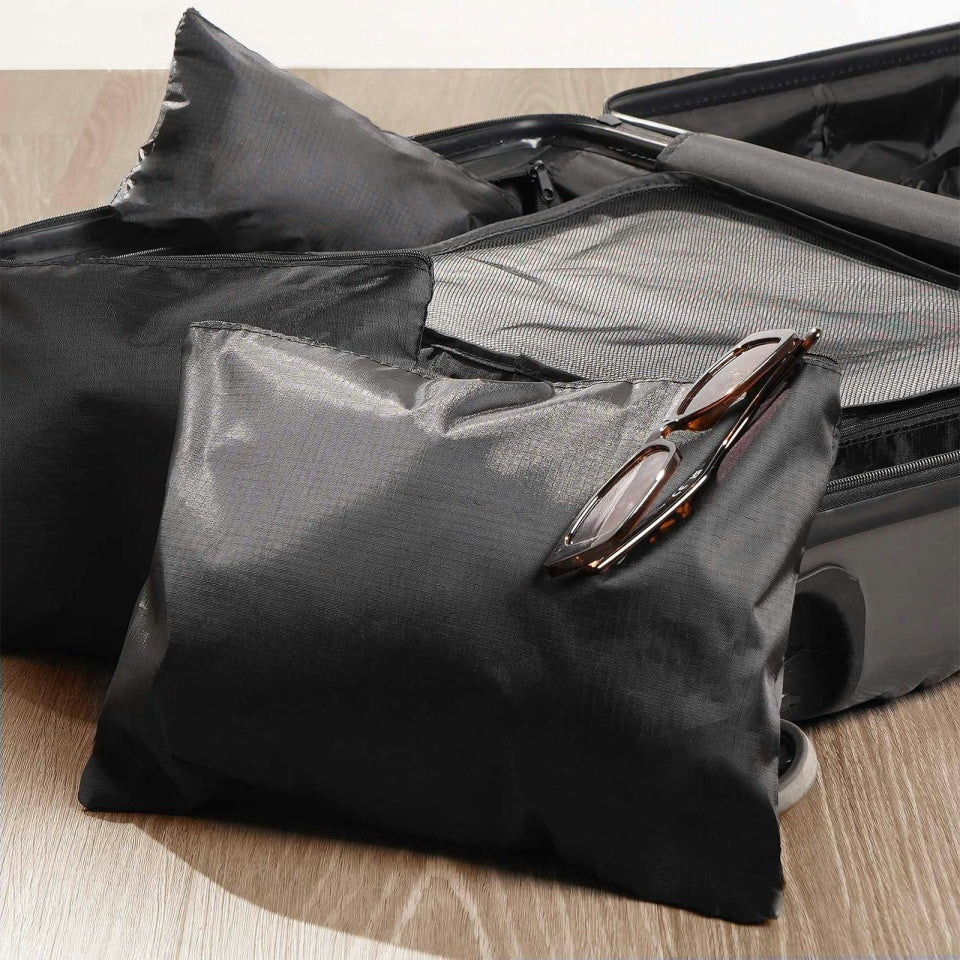 Durable black travel organizer pouches for clothes, shoes, and toiletries.